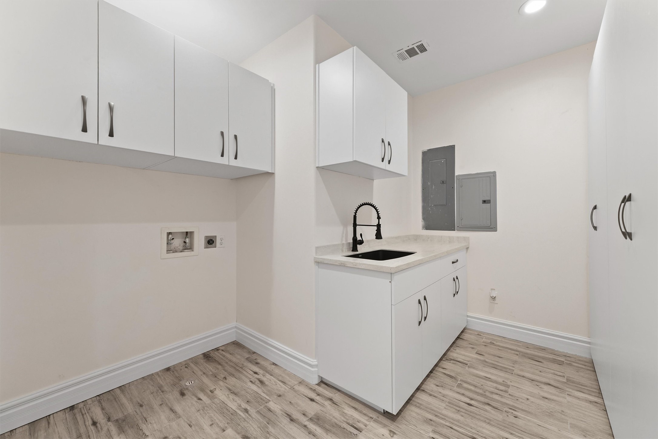 43919 Austin Branch Road Hempstead, TX 77445 - Photo 29 of 48 Expanisve utility room offering private sink and cabinetry.