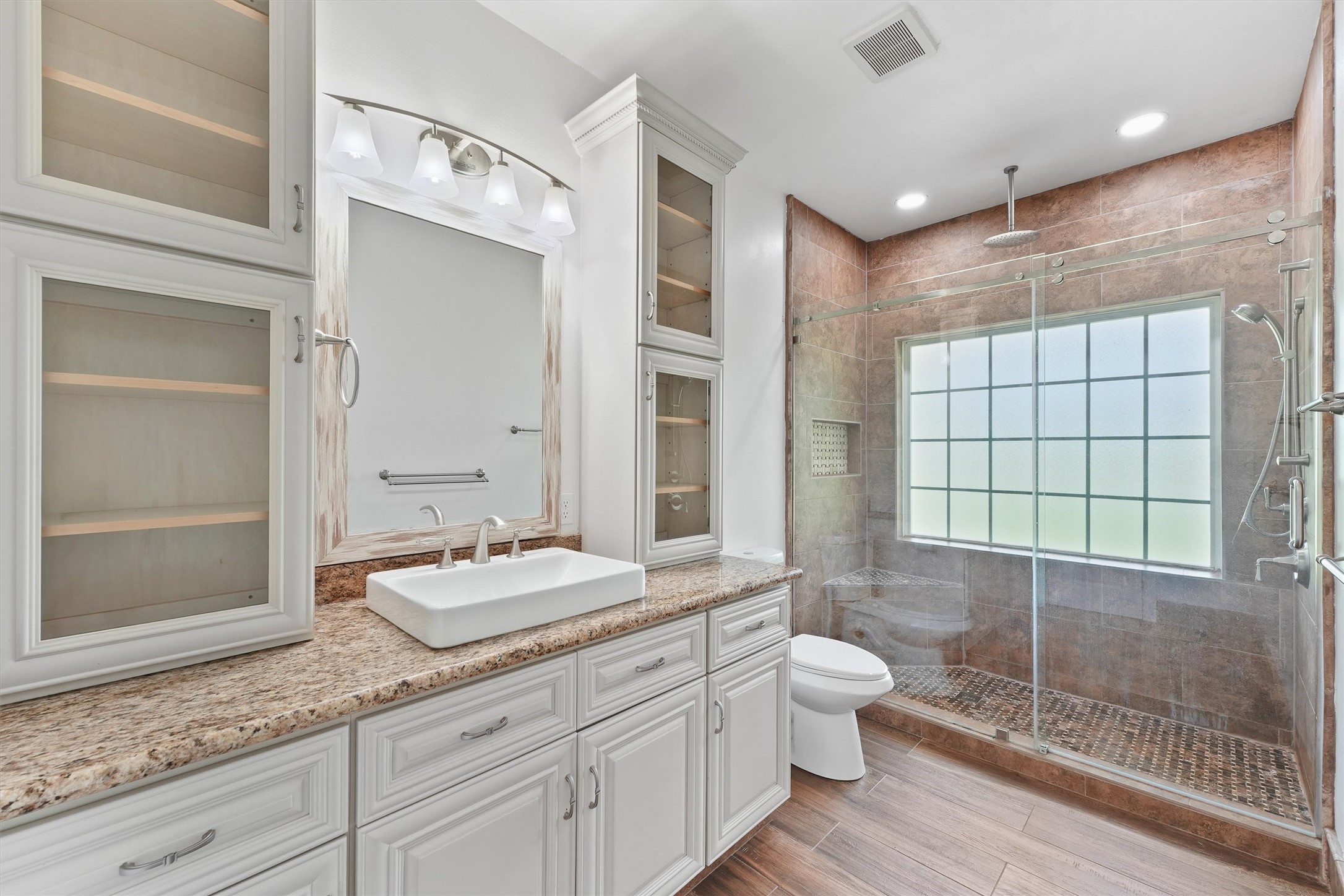 43919 Austin Branch Road Hempstead, TX 77445 - Photo 32 of 48 This beautifully appointed second bathroom features a stylish vanity with ample storage and a sleek, stand-up shower that combines function with contemporary design. Clean lines and tasteful finishes create a fresh, welcoming space perfect for family and guests alike.