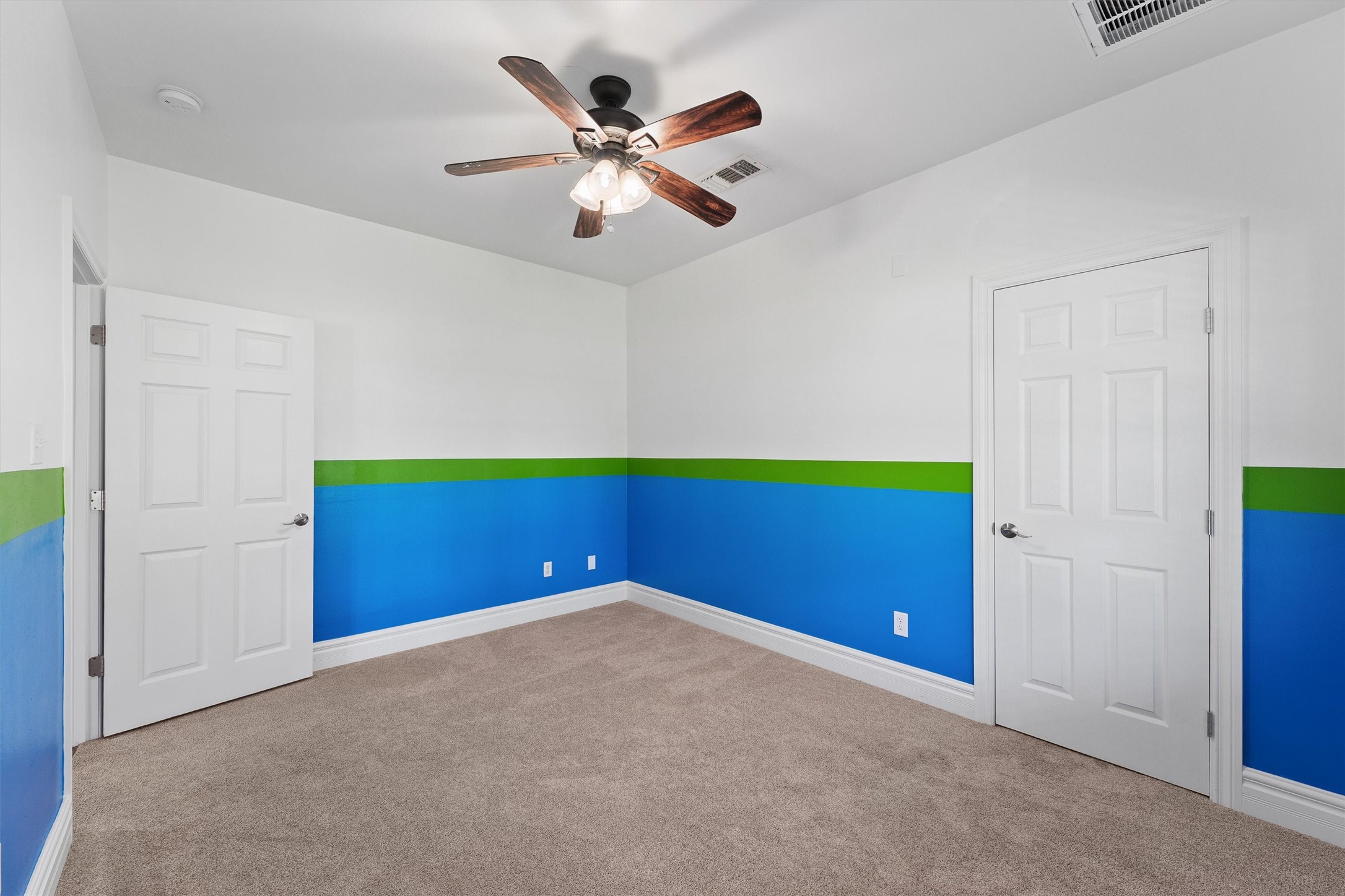 43919 Austin Branch Road Hempstead, TX 77445 - Photo 33 of 48 This charming third bedroom is filled with natural light pouring through large windows, creating a cheerful and airy atmosphere. A tailor-made closet offers plenty of organized storage, blending style and practicality seamlessly. Whether used as a cozy retreat or a creative space, this room invites comfort and versatility.