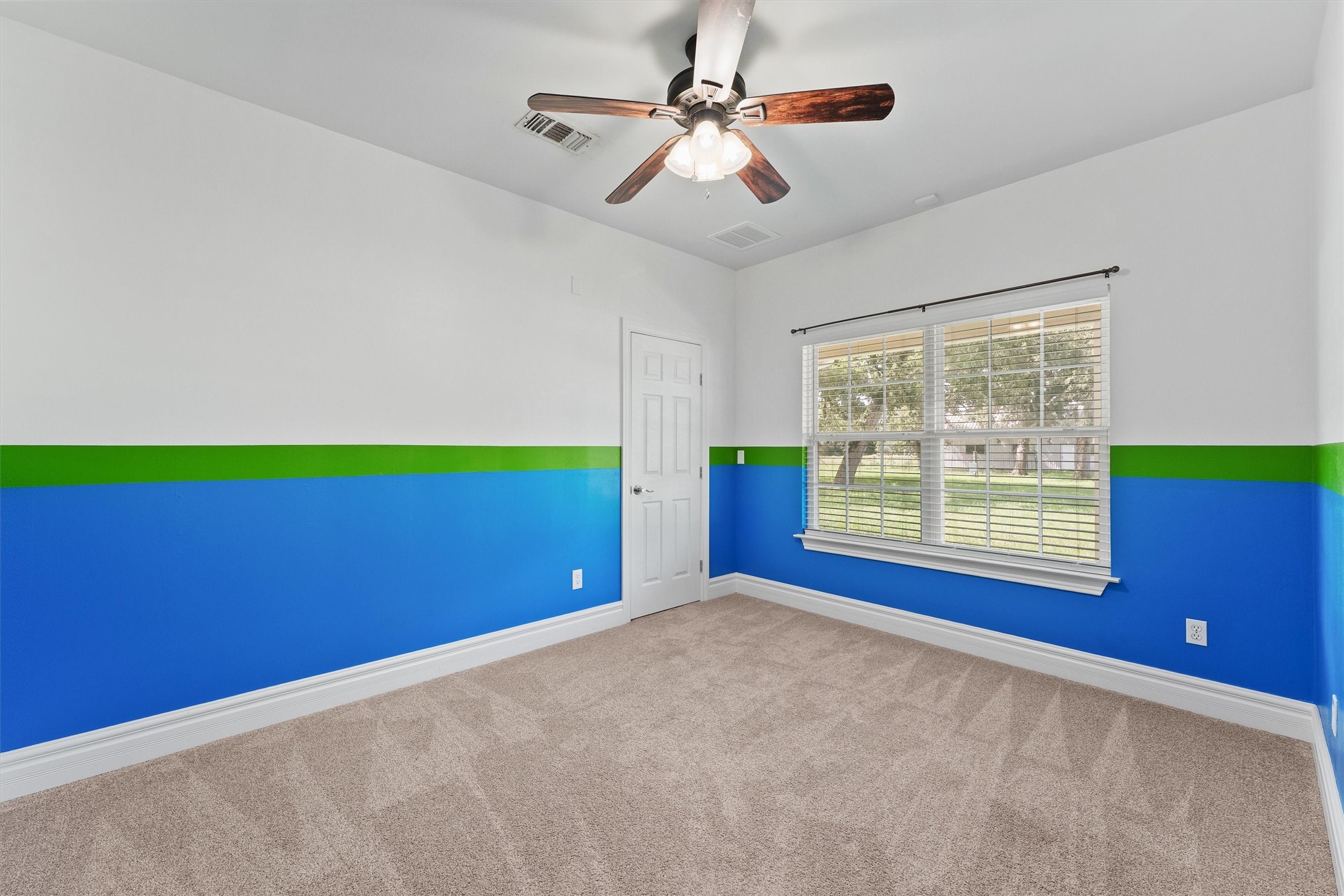 43919 Austin Branch Road Hempstead, TX 77445 - Photo 34 of 48 This charming third bedroom is filled with natural light pouring through large windows, creating a cheerful and airy atmosphere. A tailor-made closet offers plenty of organized storage, blending style and practicality seamlessly. Whether used as a cozy retreat or a creative space, this room invites comfort and versatility.