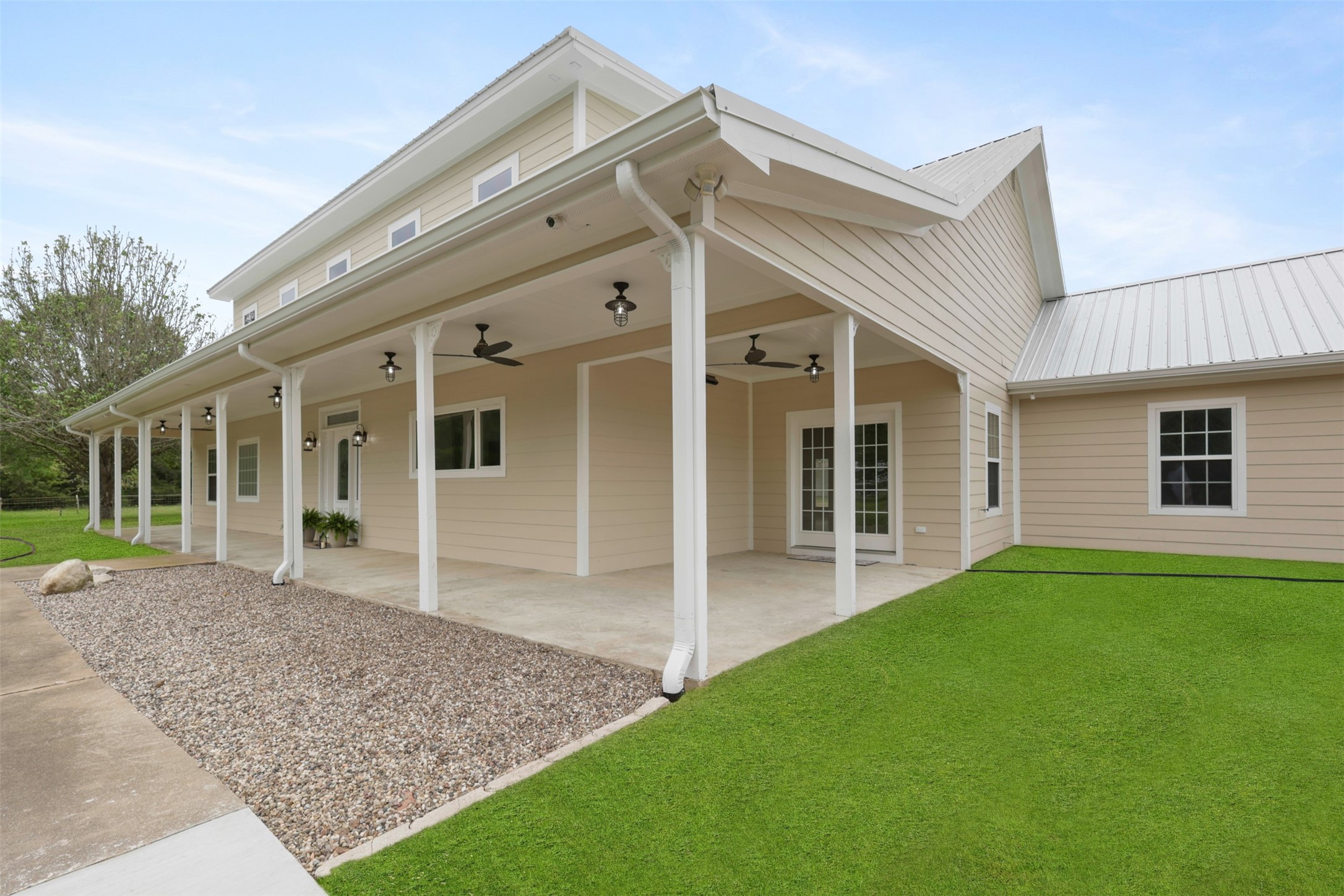 43919 Austin Branch Road Hempstead, TX 77445 - Photo 6 of 48 This spacious covered porch is the perfect outdoor retreat, complete with overhead lighting and ceiling fans for year-round comfort. Whether you're sipping sweet tea in the summer or enjoying a cozy fall evening, this space offers the ideal blend of comfort and country charm.