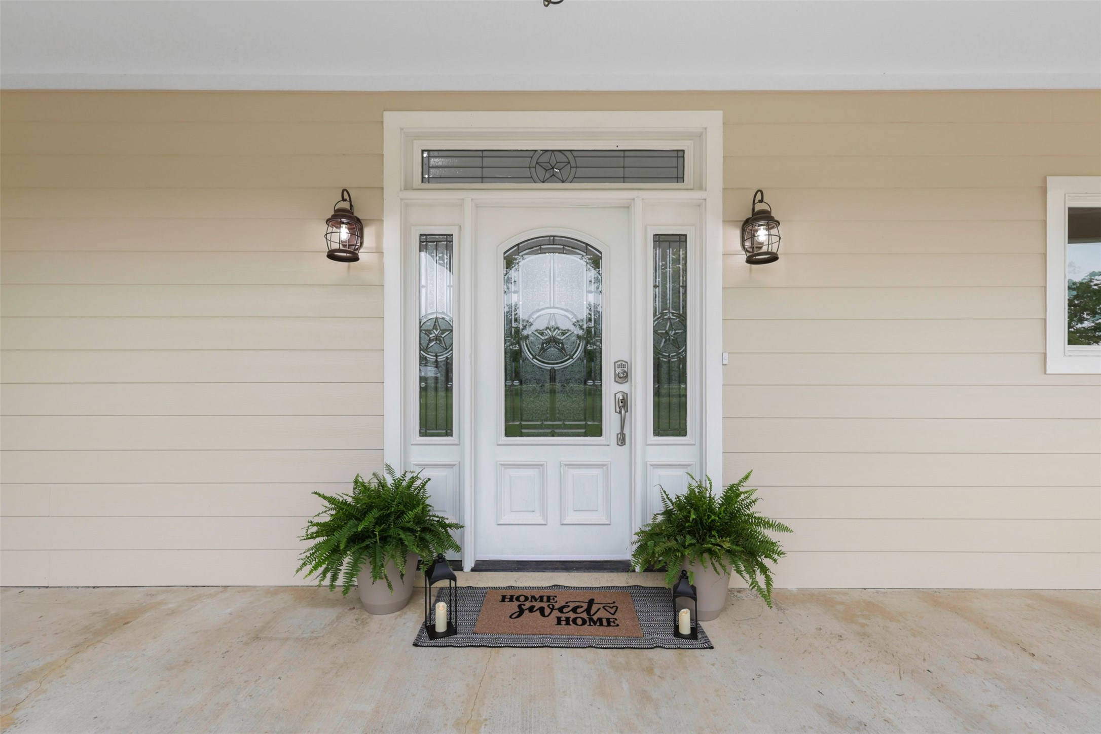43919 Austin Branch Road Hempstead, TX 77445 - Photo 7 of 48 The inviting front door sets the tone for this stunning farmhouse, featuring decorative glass, and a warm welcome that instantly feels like home. Framed by the spacious covered porch, this entrance is where timeless design and modern living begin.