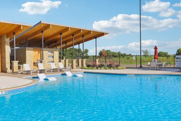 a view of pool with outdoor seating