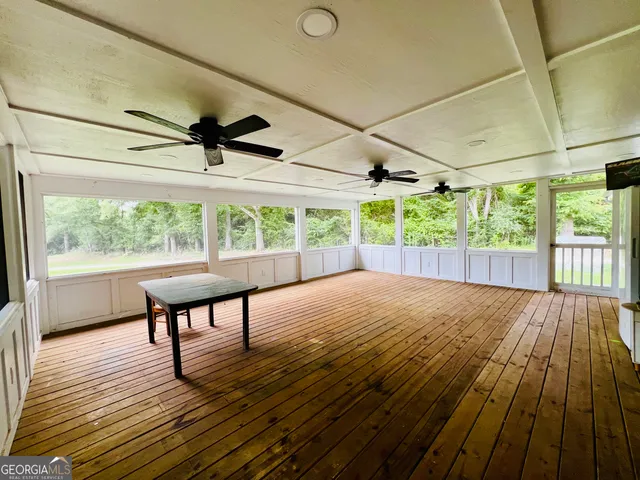 a view of porch with wooden floor
