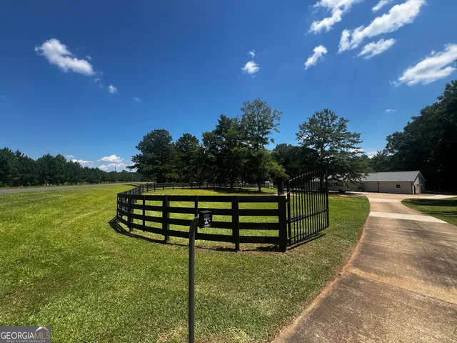 a view of a garden with sitting area