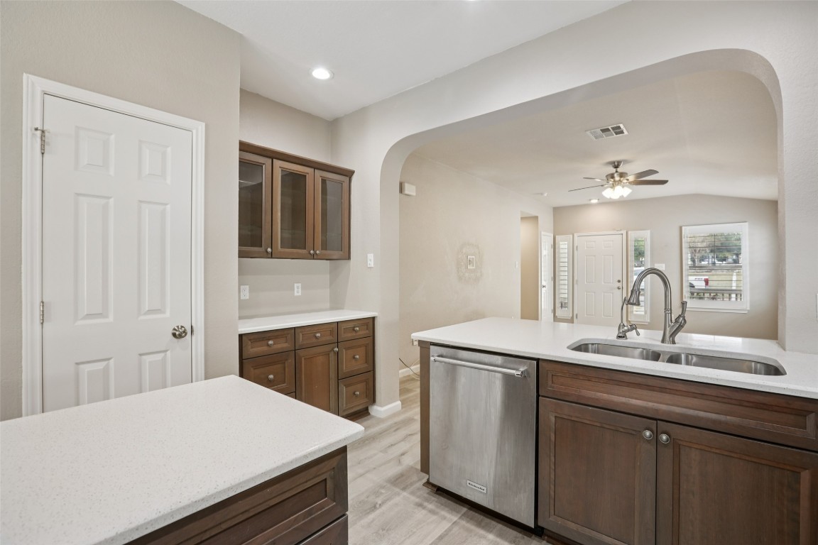 4937 Hartson Kyle, TX 78640 - Photo 14 of 40 a spacious bathroom with a granite countertop sink a toilet a mirror and vanity