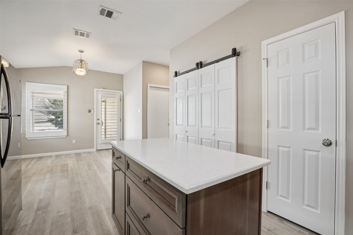4937 Hartson Kyle, TX 78640 - Photo 17 of 40 wooden floor in an empty room with a window