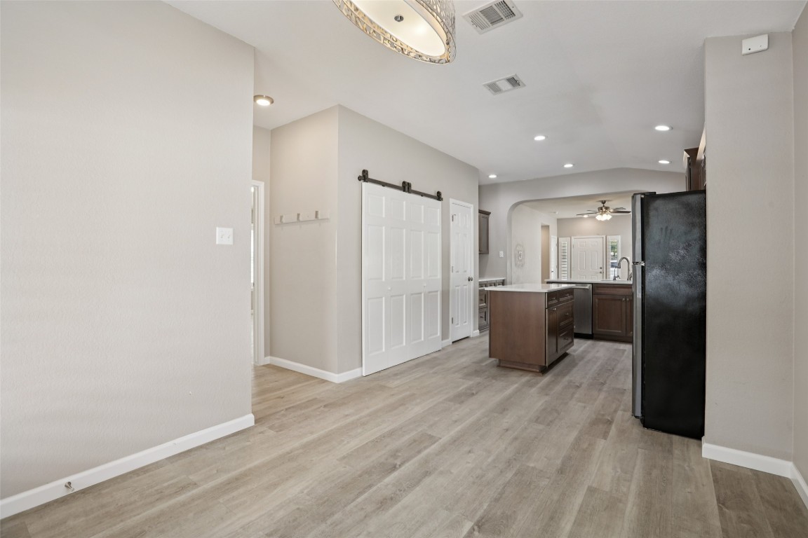 4937 Hartson Kyle, TX 78640 - Photo 18 of 40 a view of a kitchen with a refrigerator and a window