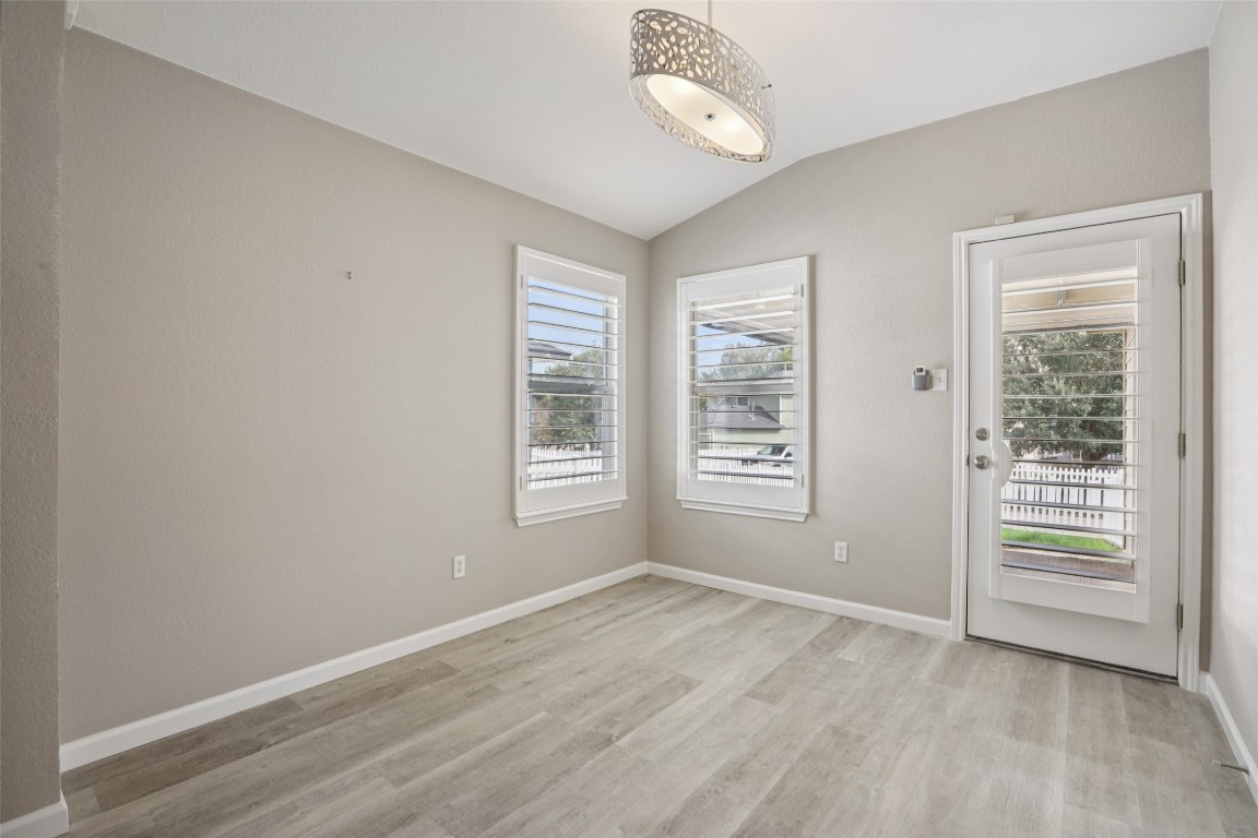4937 Hartson Kyle, TX 78640 - Photo 20 of 40 an empty room with windows closet and chandelier fan