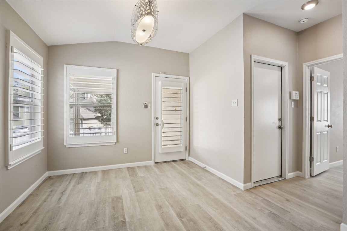 4937 Hartson Kyle, TX 78640 - Photo 21 of 40 an empty room with wooden floor and windows