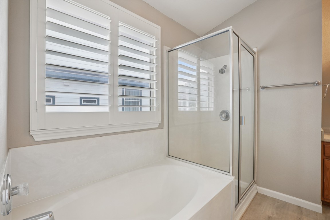 4937 Hartson Kyle, TX 78640 - Photo 25 of 40 a bathroom with a bathtub and a shower