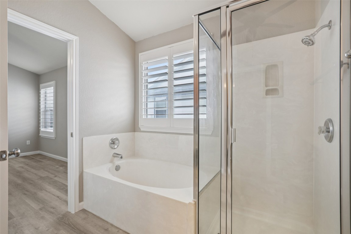 4937 Hartson Kyle, TX 78640 - Photo 26 of 40 a bathroom with a bathtub and a shower