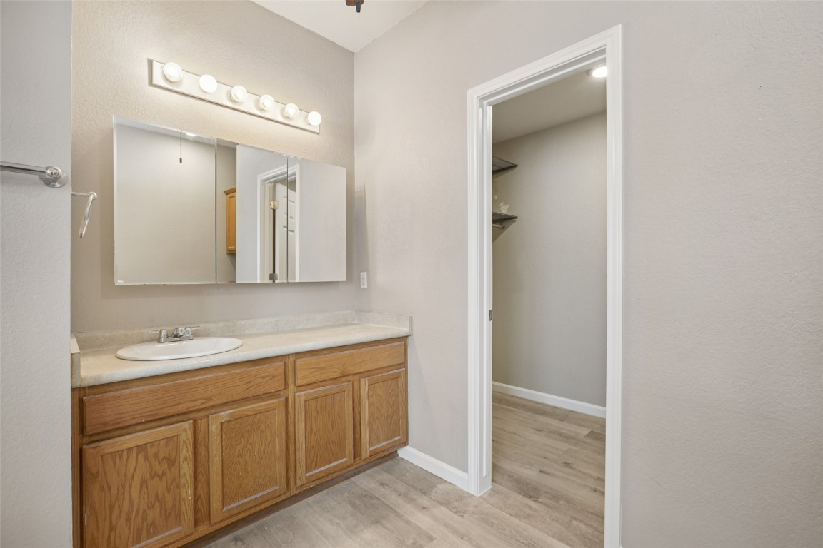 4937 Hartson Kyle, TX 78640 - Photo 27 of 40 a spacious bathroom with a double vanity sink and mirror
