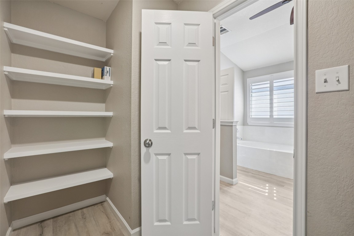 4937 Hartson Kyle, TX 78640 - Photo 28 of 40 a view of walk in closet with empty racks