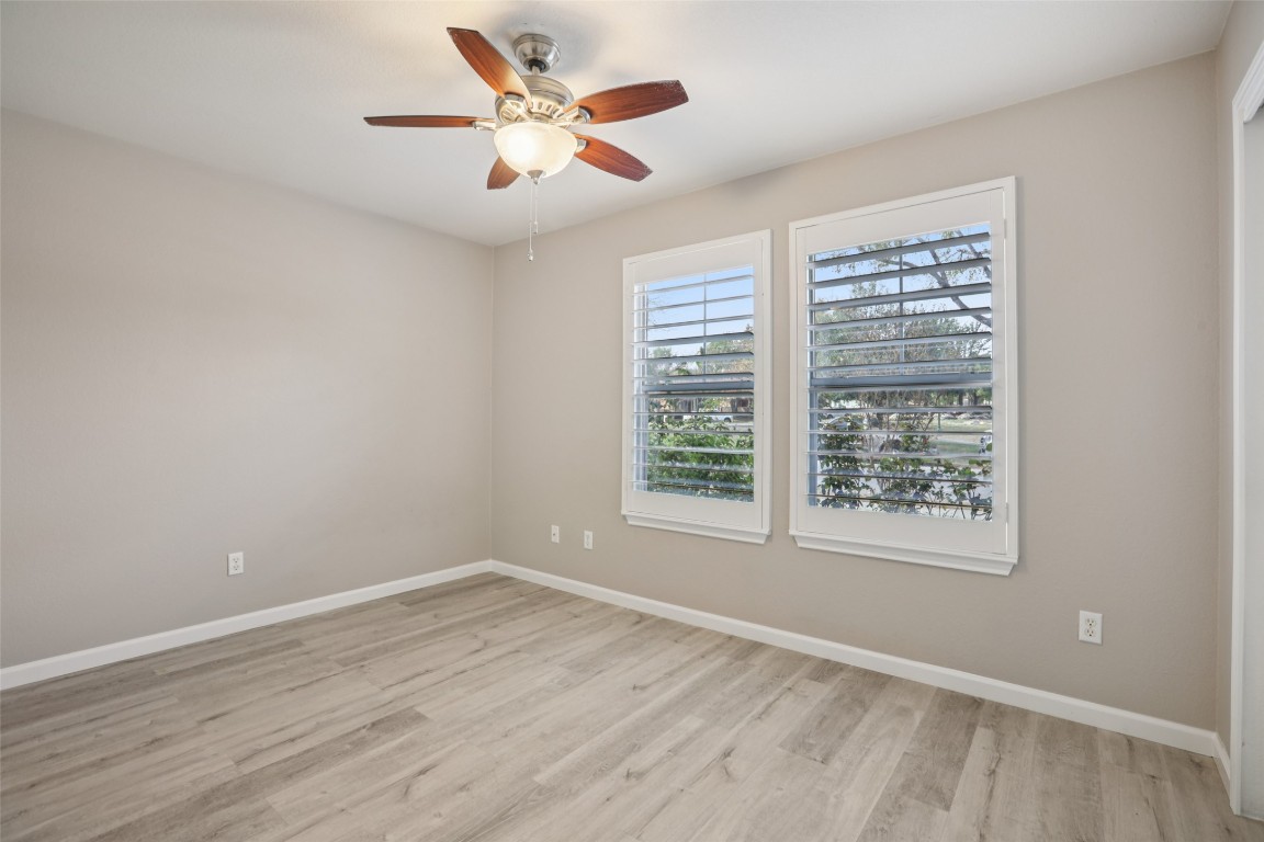 4937 Hartson Kyle, TX 78640 - Photo 31 of 40 wooden floor in an empty room with a window