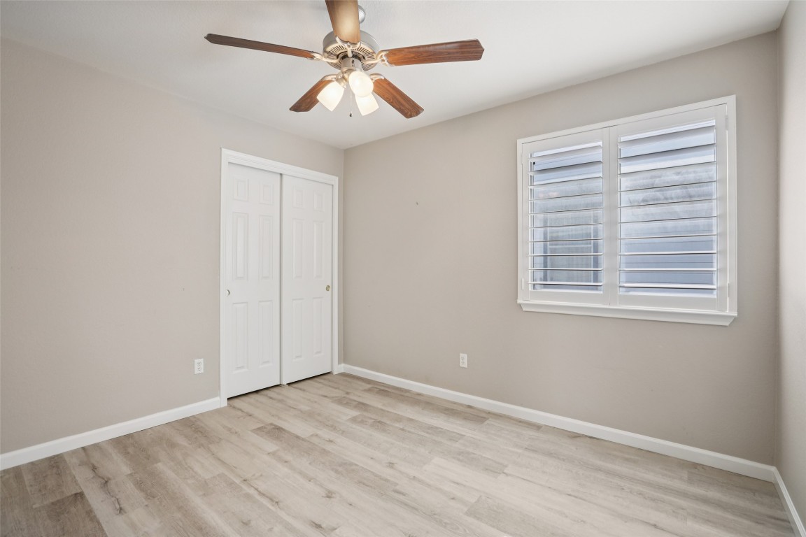 4937 Hartson Kyle, TX 78640 - Photo 33 of 40 wooden floor in an empty room with a window