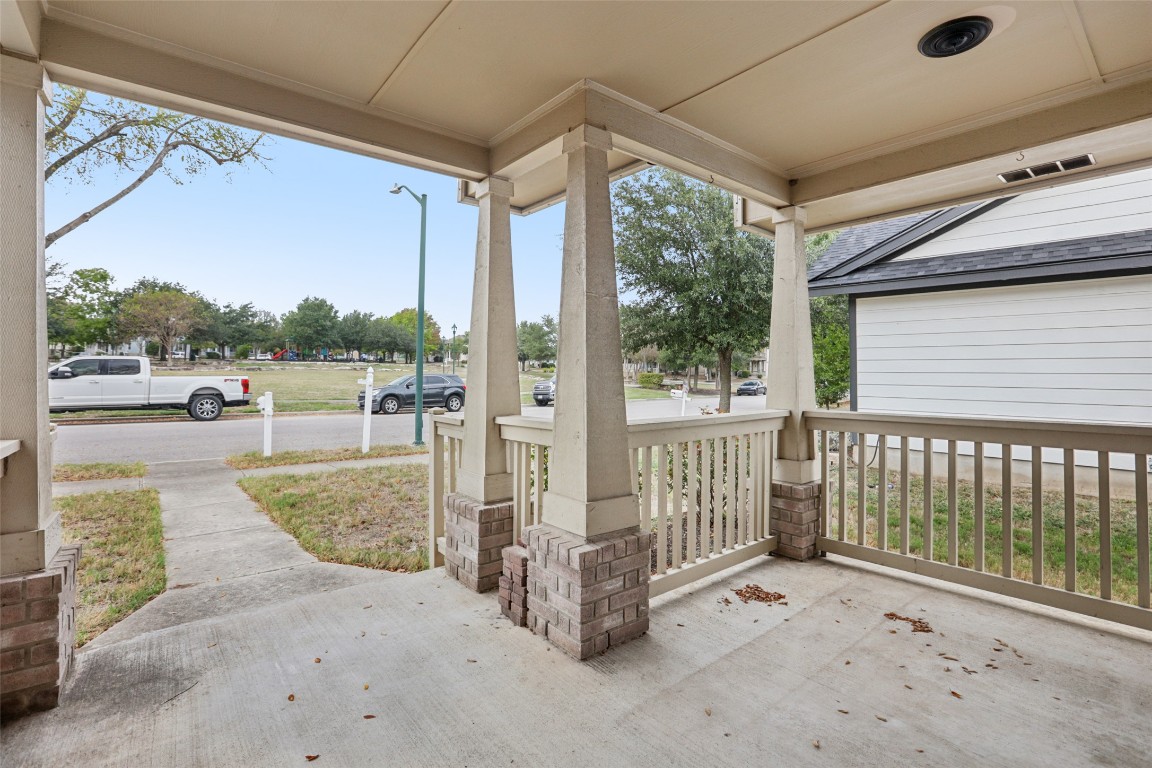 4937 Hartson Kyle, TX 78640 - Photo 6 of 40 a view of a porch with wooden floor and iron fence