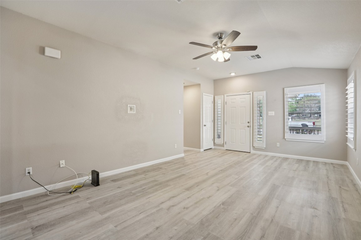 4937 Hartson Kyle, TX 78640 - Photo 9 of 40 wooden floor in an empty room with a window