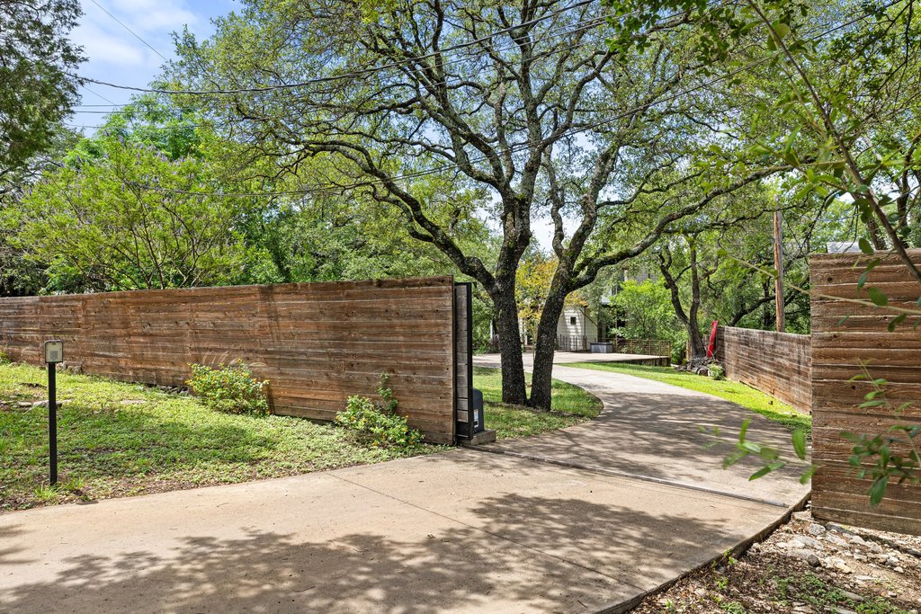 801 The High Road Austin, TX 78746 - Photo 37 of 40 a view of a backyard with tree