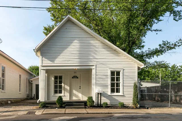 a view of a room with wooden walls