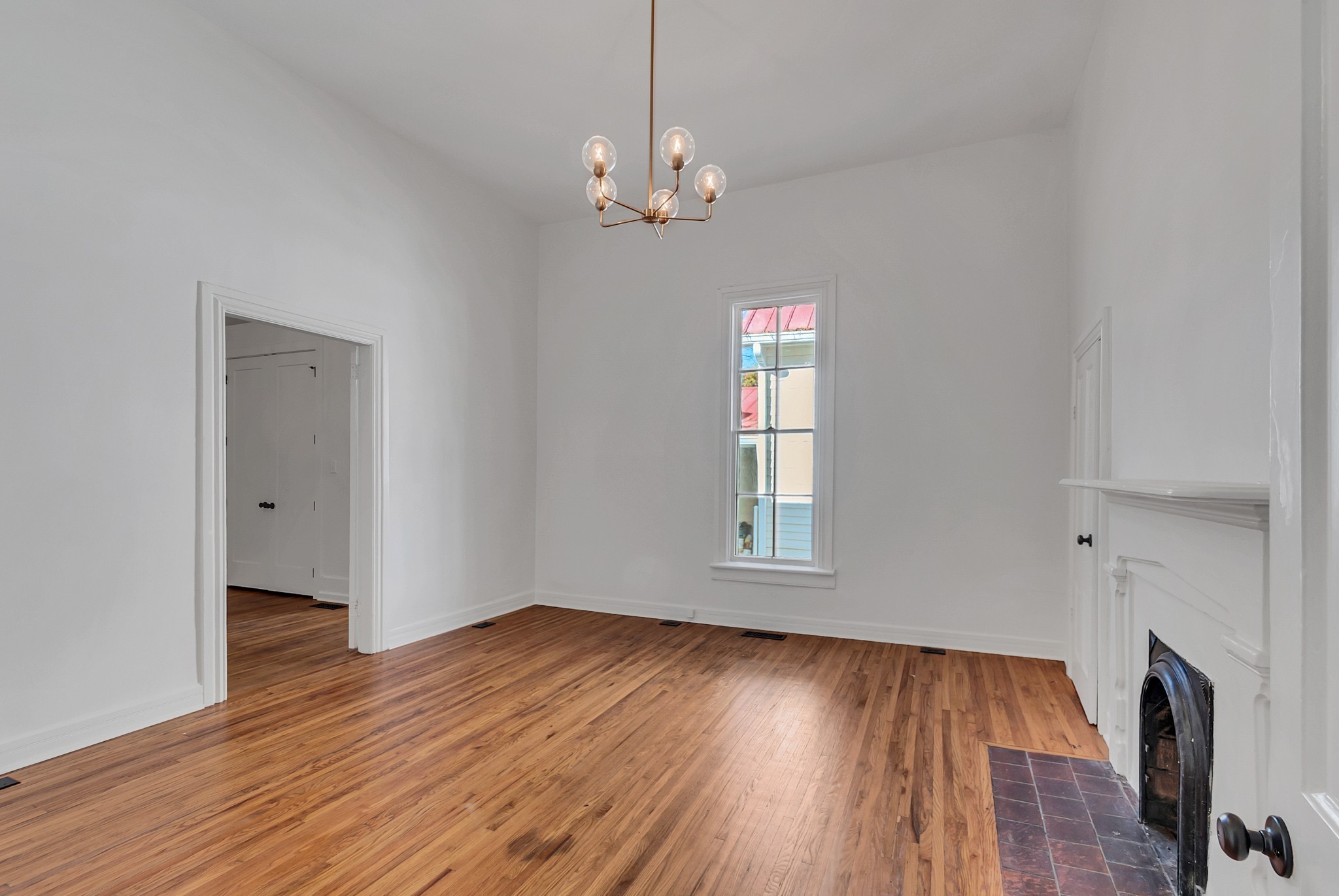 209 West 13th Street Columbia, TN 38401 - Photo 37 of 84 wooden floor in an empty room with a window
