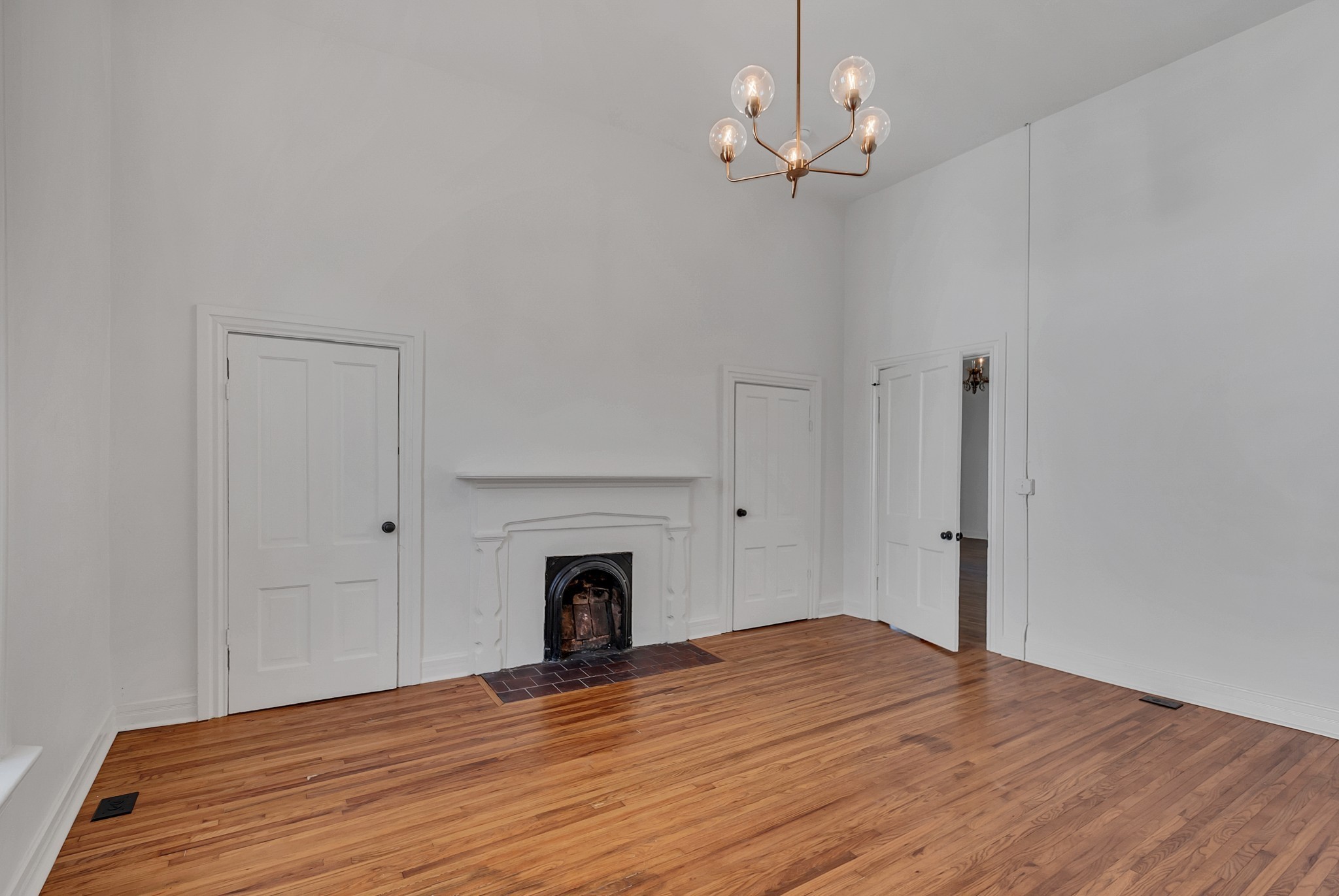 209 West 13th Street Columbia, TN 38401 - Photo 38 of 84 a view of empty room with wooden floor and fireplace