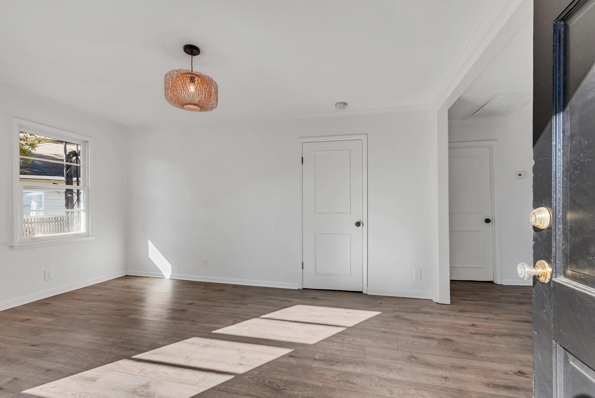 209 West 13th Street Columbia, TN 38401 - Photo 52 of 84 an empty room with wooden floor and windows