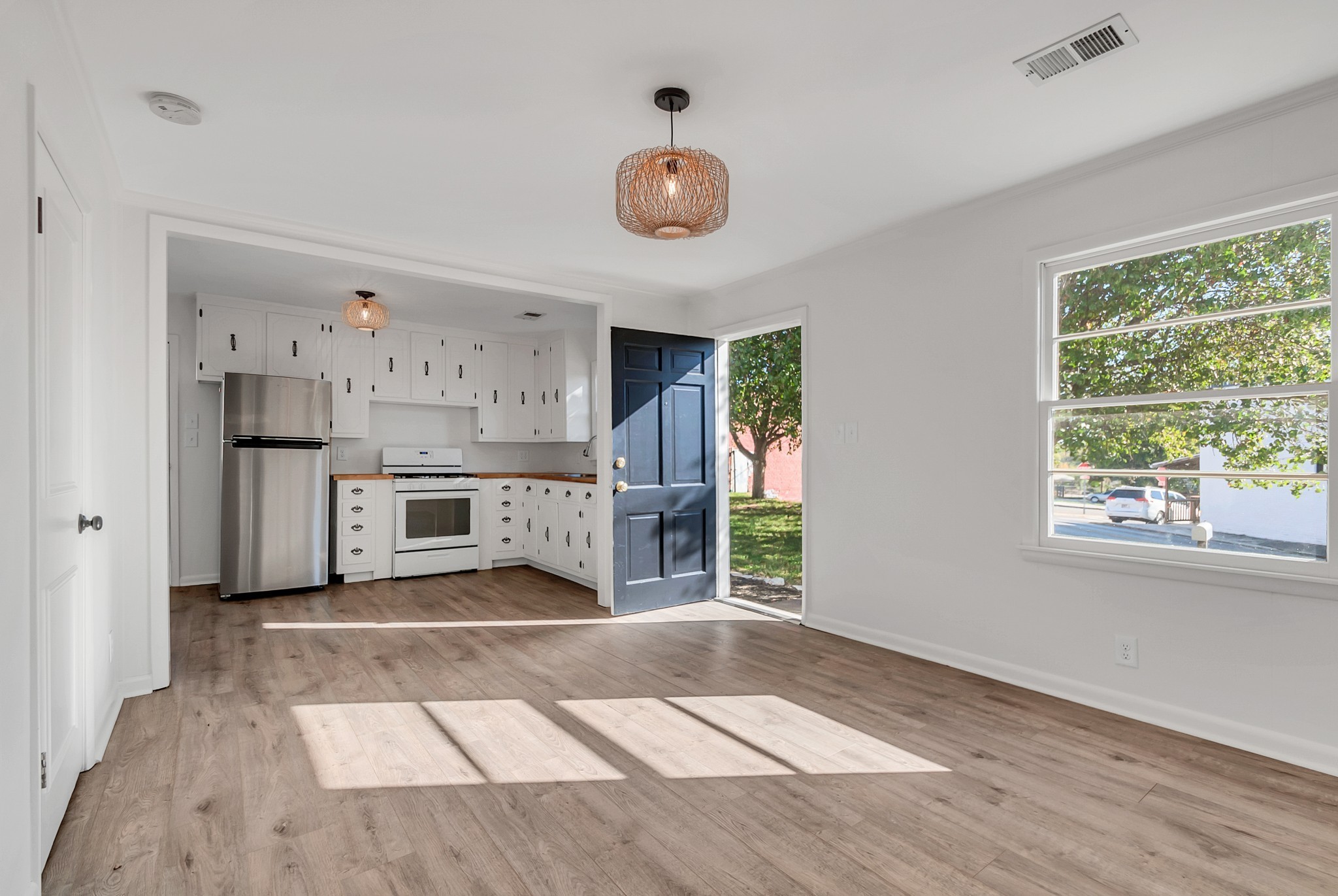 209 West 13th Street Columbia, TN 38401 - Photo 53 of 84 a open kitchen with stainless steel appliances granite countertop a stove a refrigerator and a cabinets