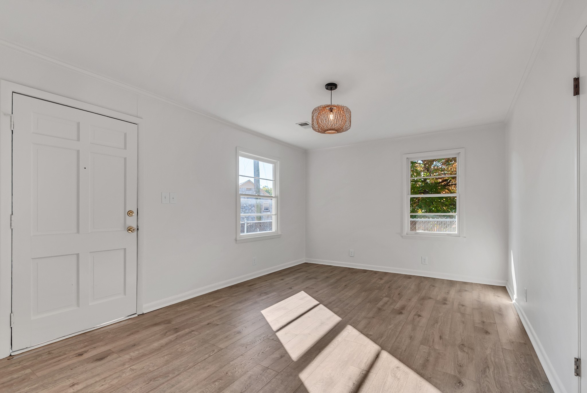 209 West 13th Street Columbia, TN 38401 - Photo 54 of 84 an empty room with wooden floor and windows