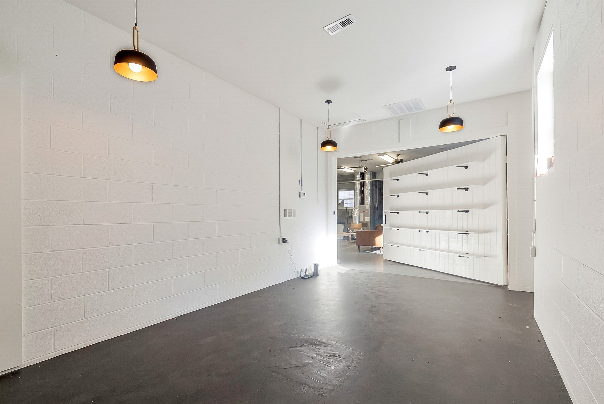 209 West 13th Street Columbia, TN 38401 - Photo 75 of 84 a view of a storage & utility room with racks on the wall