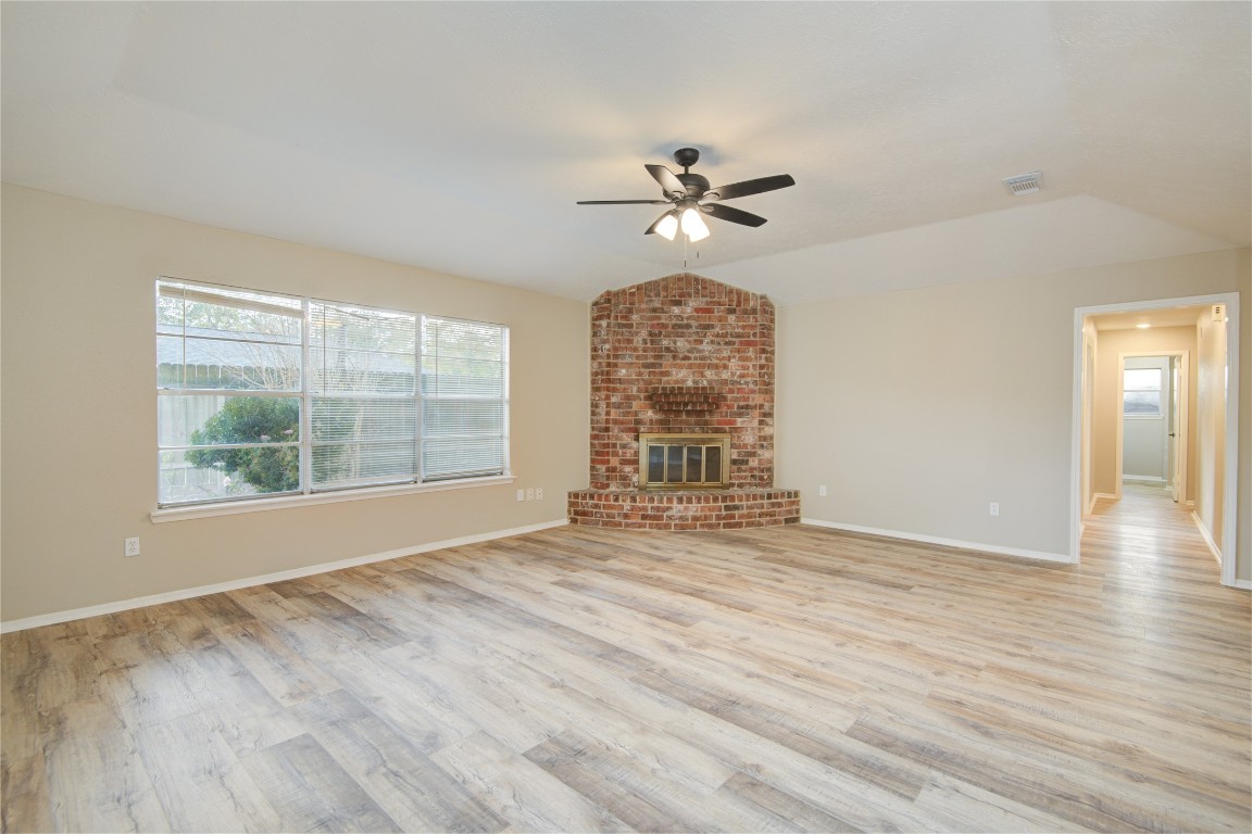 6722 Lynngate Drive Spring, TX 77373 - Photo 15 of 31 a view of an empty room with a window and wooden floor