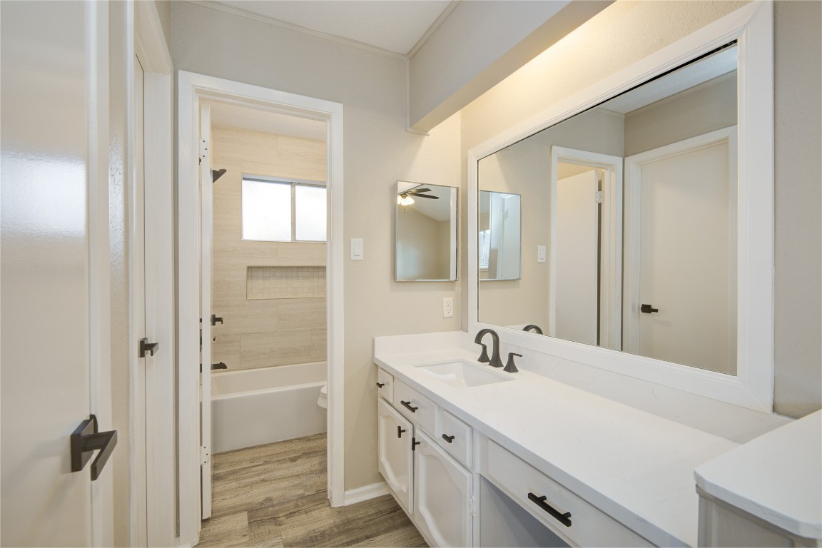 6722 Lynngate Drive Spring, TX 77373 - Photo 19 of 31 a bathroom with a double vanity sink a mirror and a shower