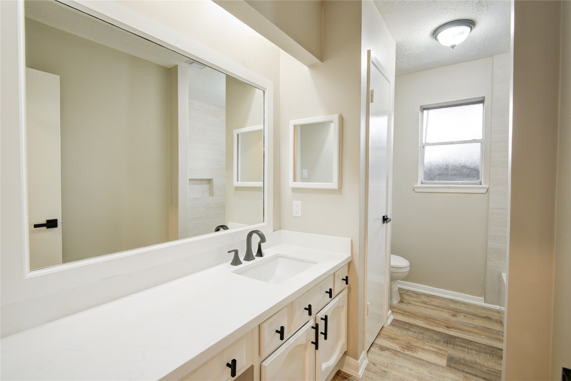 6722 Lynngate Drive Spring, TX 77373 - Photo 25 of 31 a bathroom with a double vanity sink and a mirror