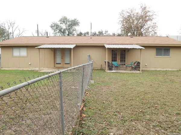 a front view of a house with ocean