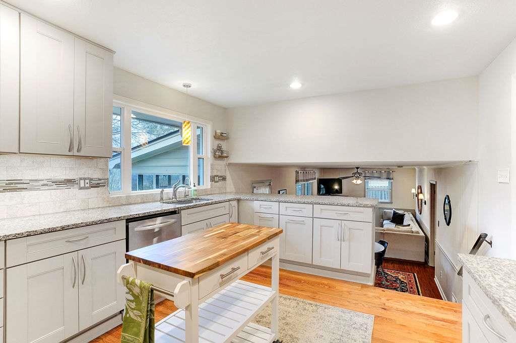 2889 Rotherwood Drive Tucker, GA 30084 - Photo 13 of 49 a kitchen with stainless steel appliances granite countertop a sink and cabinets