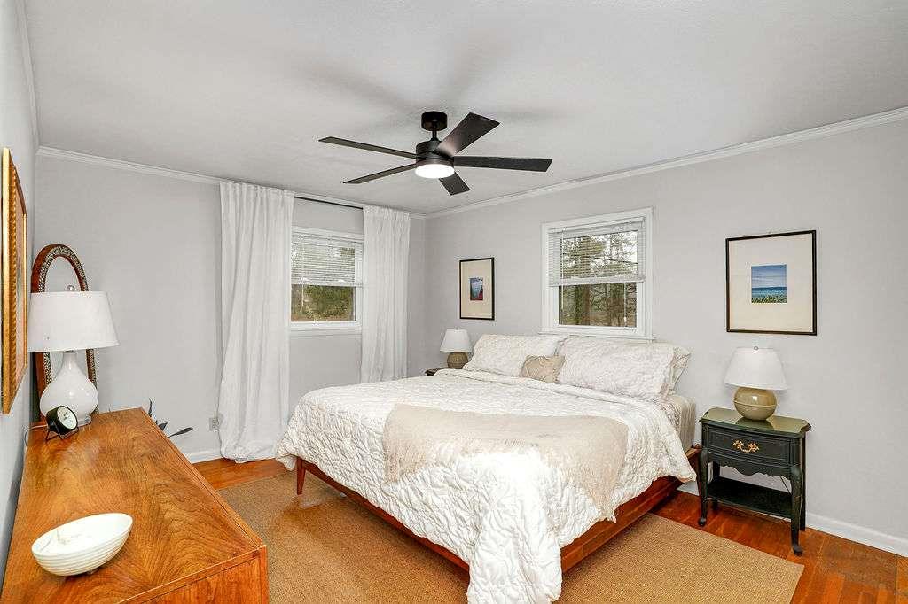 2889 Rotherwood Drive Tucker, GA 30084 - Photo 20 of 49 a bedroom with a bed and a chandelier