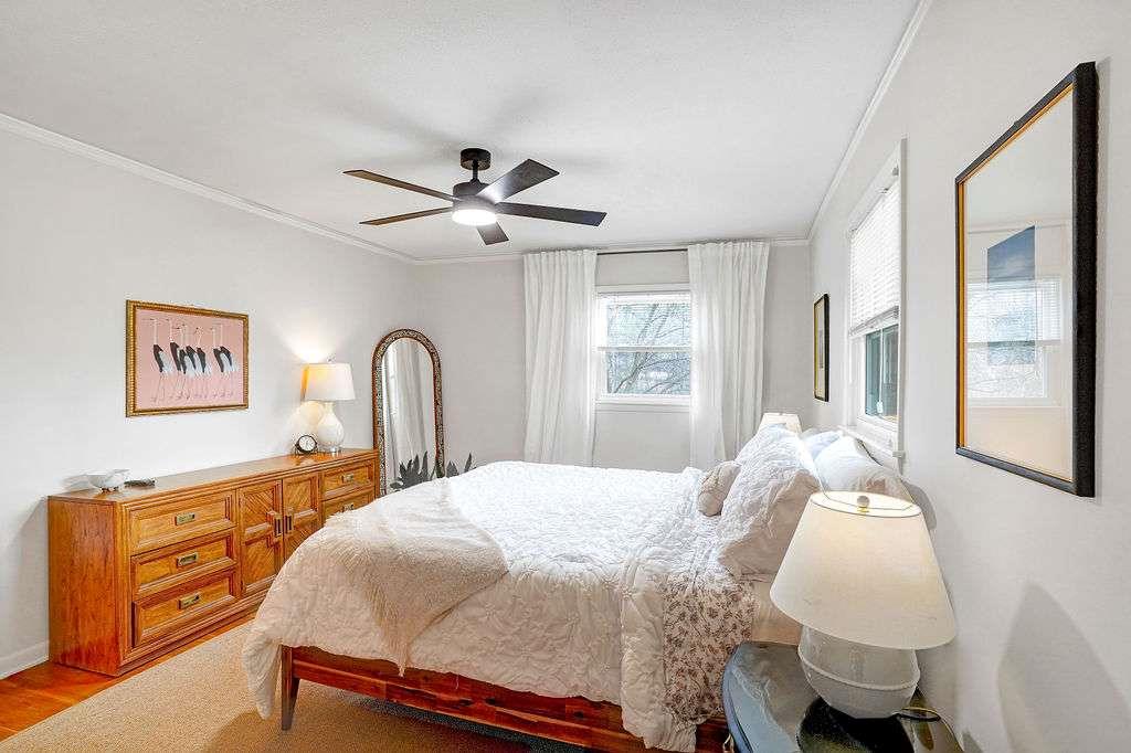 2889 Rotherwood Drive Tucker, GA 30084 - Photo 21 of 49 a bedroom with a bed and a dresser next to a window