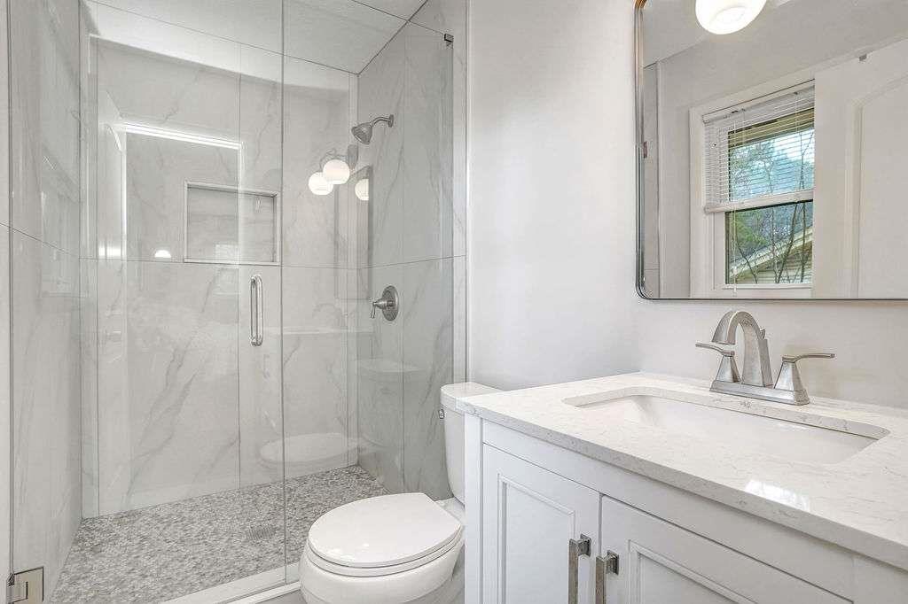 2889 Rotherwood Drive Tucker, GA 30084 - Photo 24 of 49 a bathroom with a sink a toilet and shower