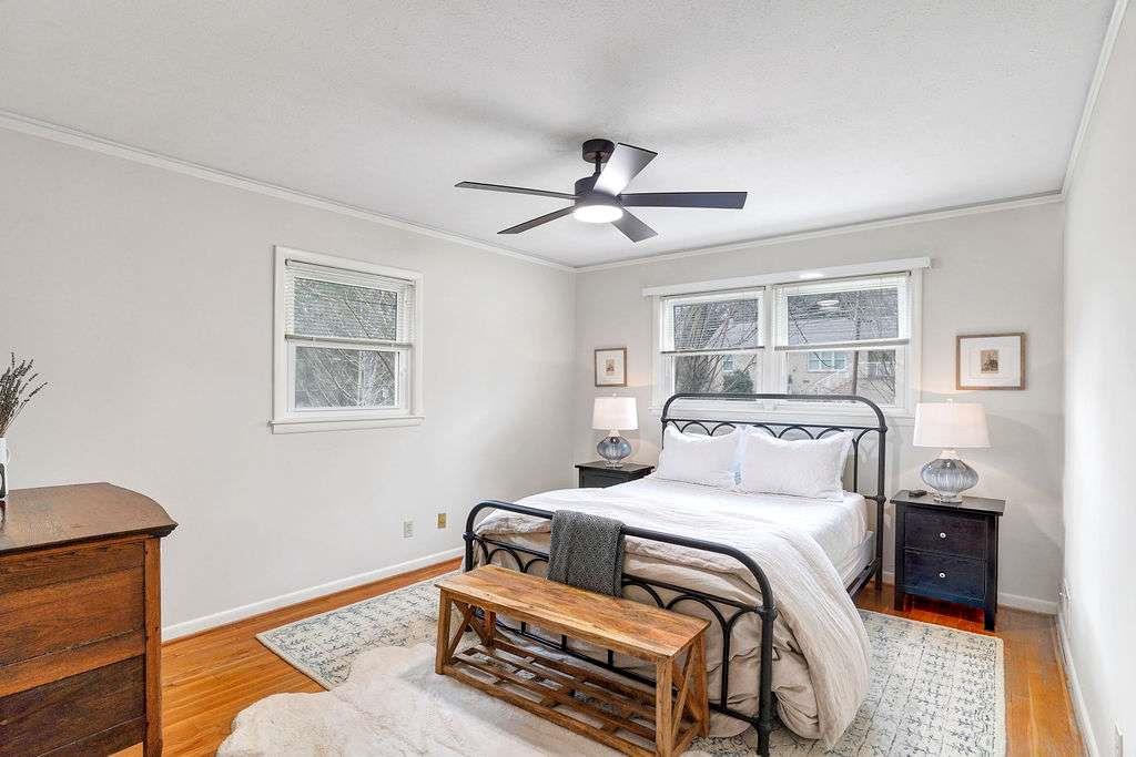 2889 Rotherwood Drive Tucker, GA 30084 - Photo 25 of 49 a bedroom with a bed and wooden floor