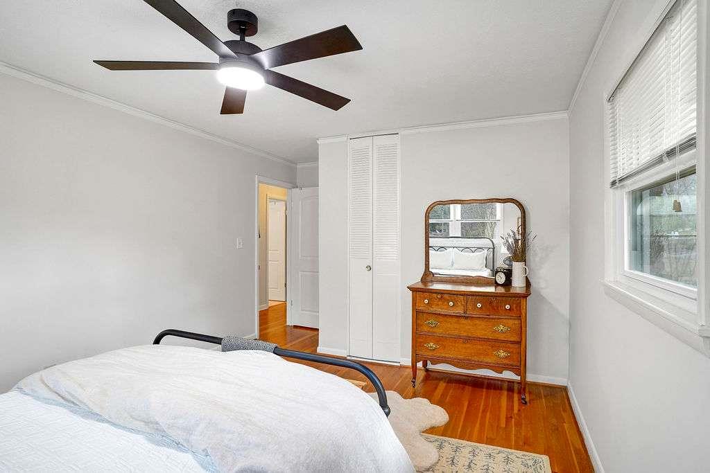 2889 Rotherwood Drive Tucker, GA 30084 - Photo 26 of 49 a bedroom with a bed and wooden floor