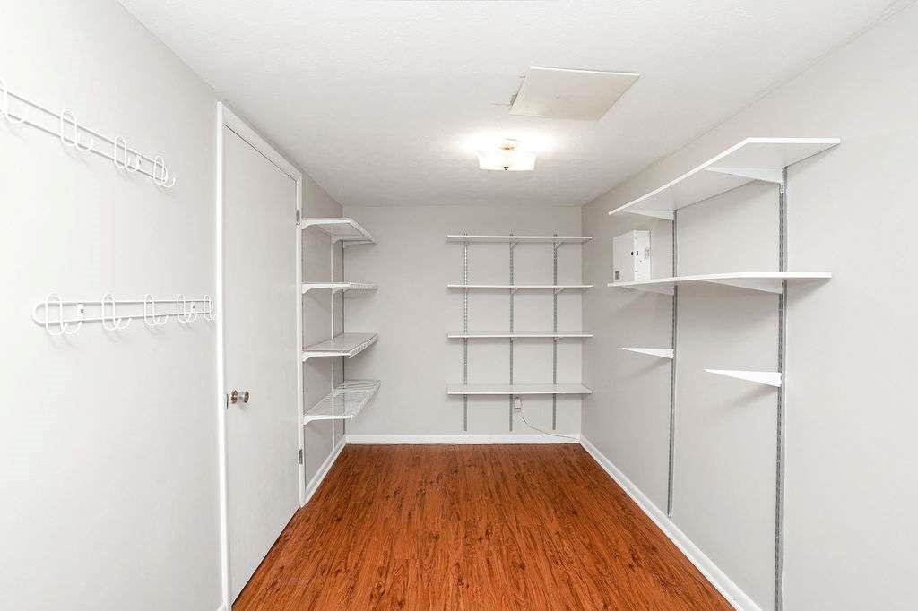 2889 Rotherwood Drive Tucker, GA 30084 - Photo 35 of 49 a view of a room with wooden floor and empty shelves