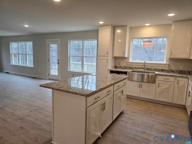 1337 Salem Church Road Palmyra, VA 22963 - Photo 20 of 21 a kitchen with stainless steel appliances granite countertop a stove a sink and a microwave