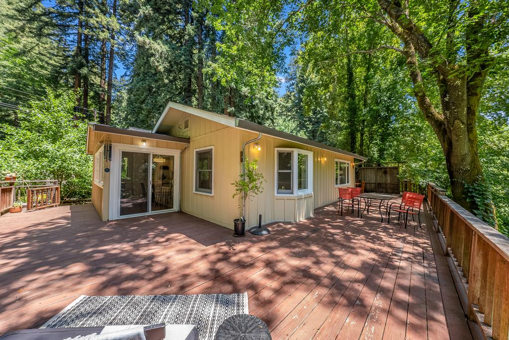 168 Riverside Drive Boulder Creek, CA 95006 - Photo 12 of 52 a view of a house with backyard and sitting area