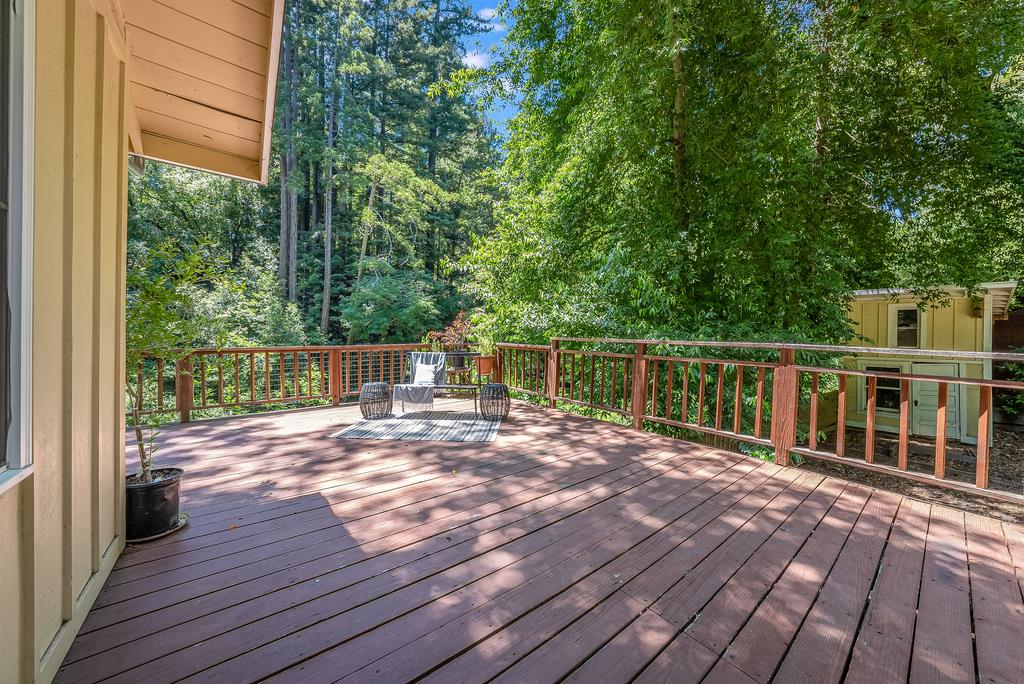 168 Riverside Drive Boulder Creek, CA 95006 - Photo 18 of 52 a view of a deck with wooden floor and fence