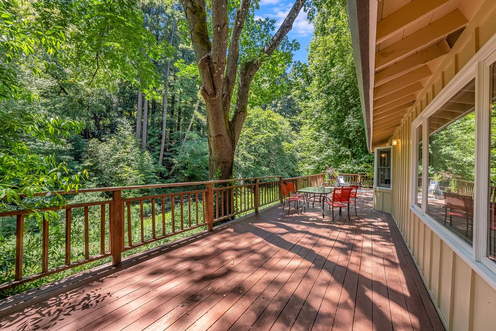 168 Riverside Drive Boulder Creek, CA 95006 - Photo 2 of 52 a balcony with furniture and wooden floor