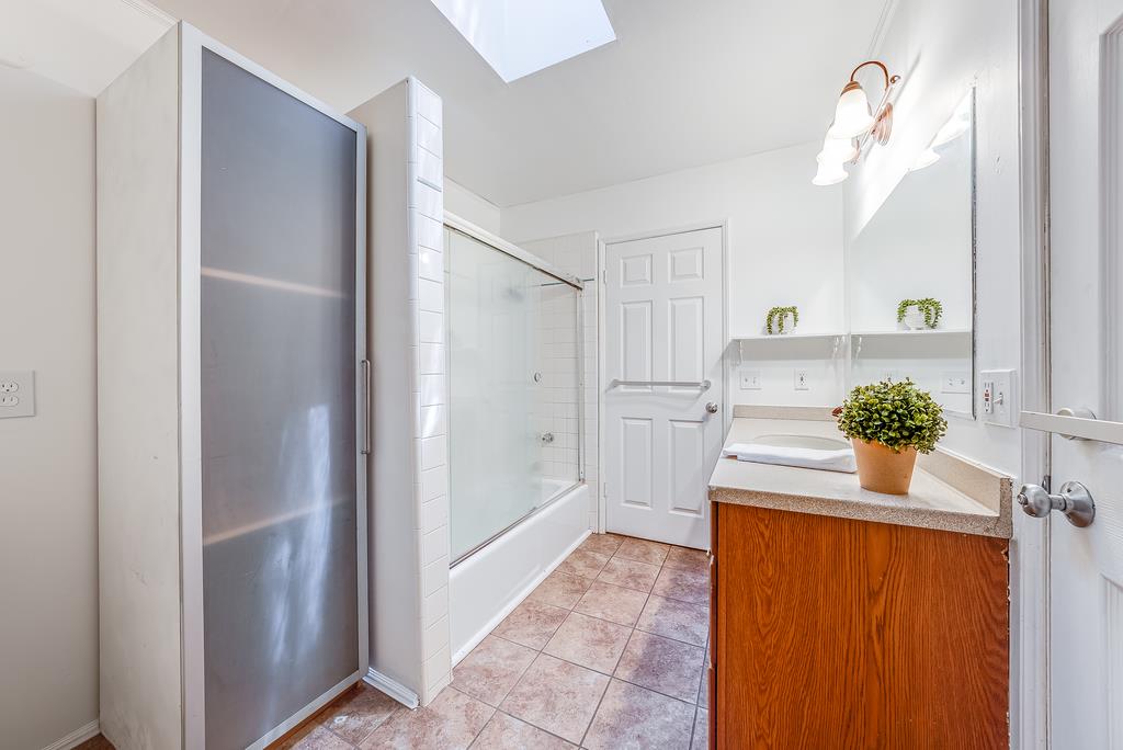 168 Riverside Drive Boulder Creek, CA 95006 - Photo 24 of 52 a view of a hallway to a livingroom with furniture and wooden floor
