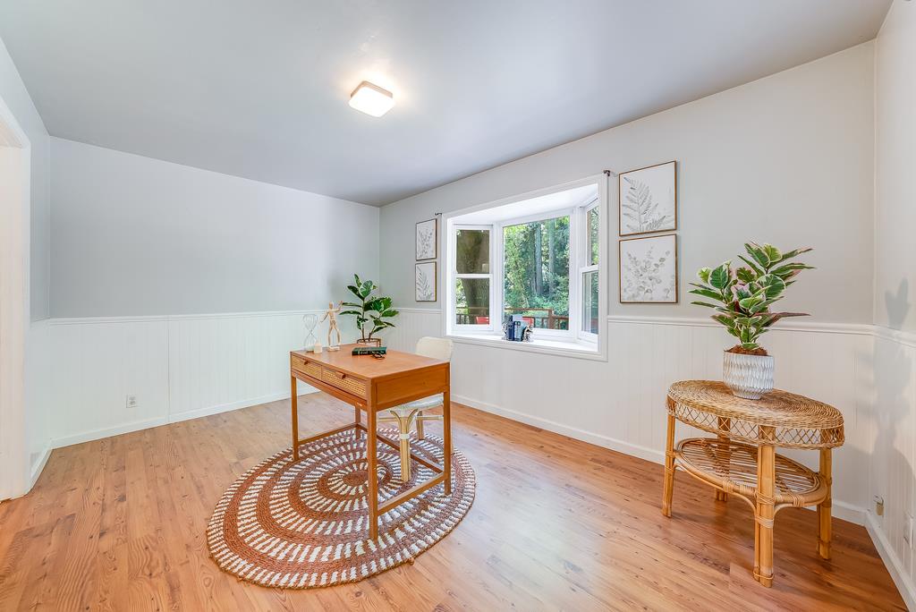 168 Riverside Drive Boulder Creek, CA 95006 - Photo 26 of 52 a living room with furniture and a potted plant