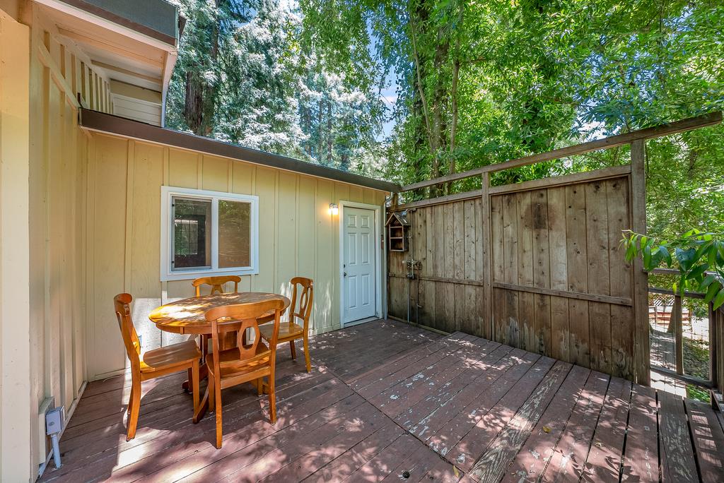 168 Riverside Drive Boulder Creek, CA 95006 - Photo 30 of 52 a backyard of a house with barbeque oven and outdoor seating