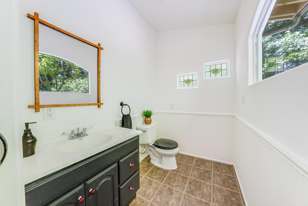 168 Riverside Drive Boulder Creek, CA 95006 - Photo 32 of 52 a bathroom with a sink and a mirror