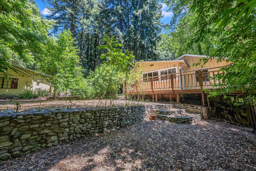 168 Riverside Drive Boulder Creek, CA 95006 - Photo 45 of 52 a view of a house with a yard and sitting area